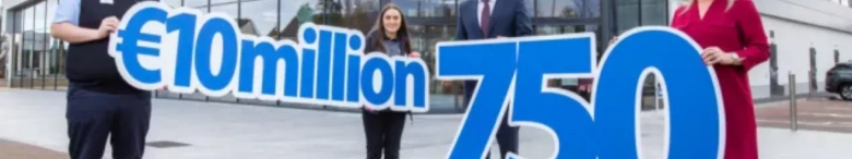 people in front of a Lidl store holding €10million sign and the numbers 750
