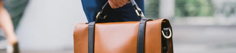 An interview candidate carrying a bag, symbolising the interview question 'What can you bring to the company?' 
