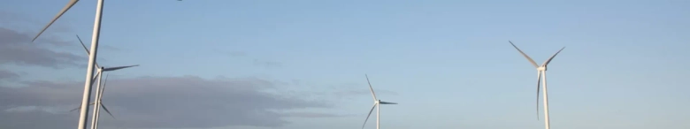 Wind turbines with a blue sky in the background
