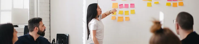 Woman giving a presentation to a team