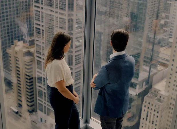 Two people standing