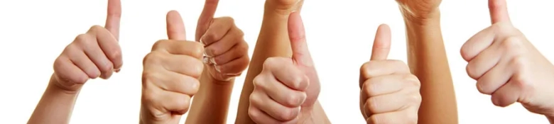 Six hands making thumbs up gesture