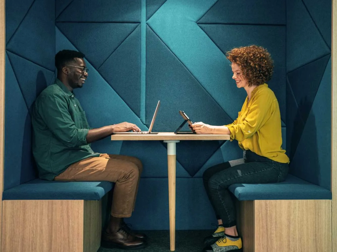man and woman working in cubicle