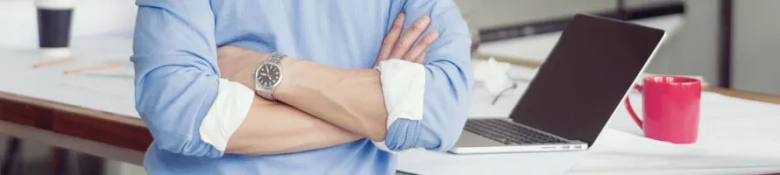 Man in office clothing with a laptop